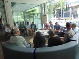 Conference Participants sitting in a circle